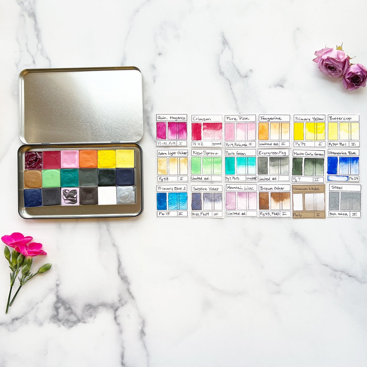 The Flower Painter's Set, 18 square pans of watercolor paint in a black tin