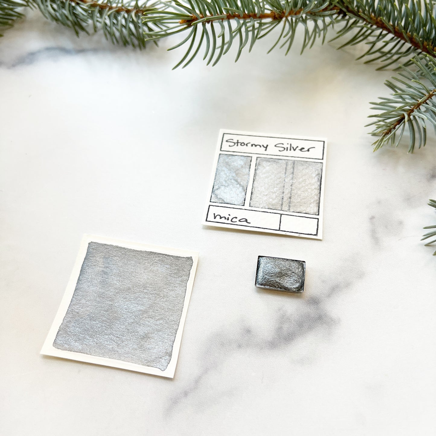 Stormy Silver. Half pan, full pan or bottle cap of handmade watercolor paint