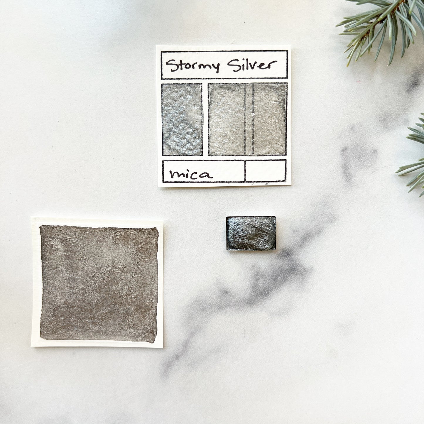 Stormy Silver. Half pan, full pan or bottle cap of handmade watercolor paint