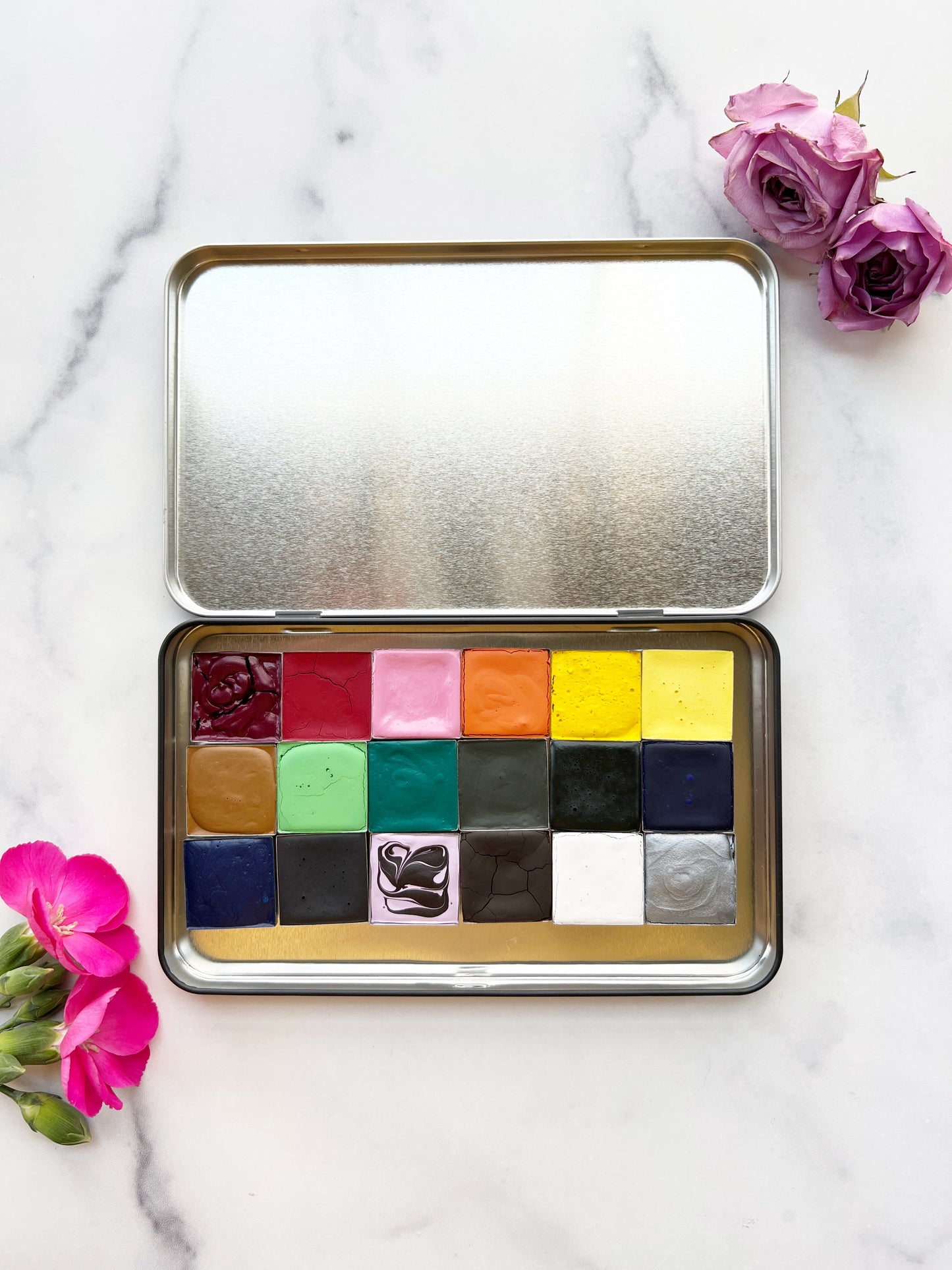 The Flower Painter's Set, 18 square pans of watercolor paint in a black tin