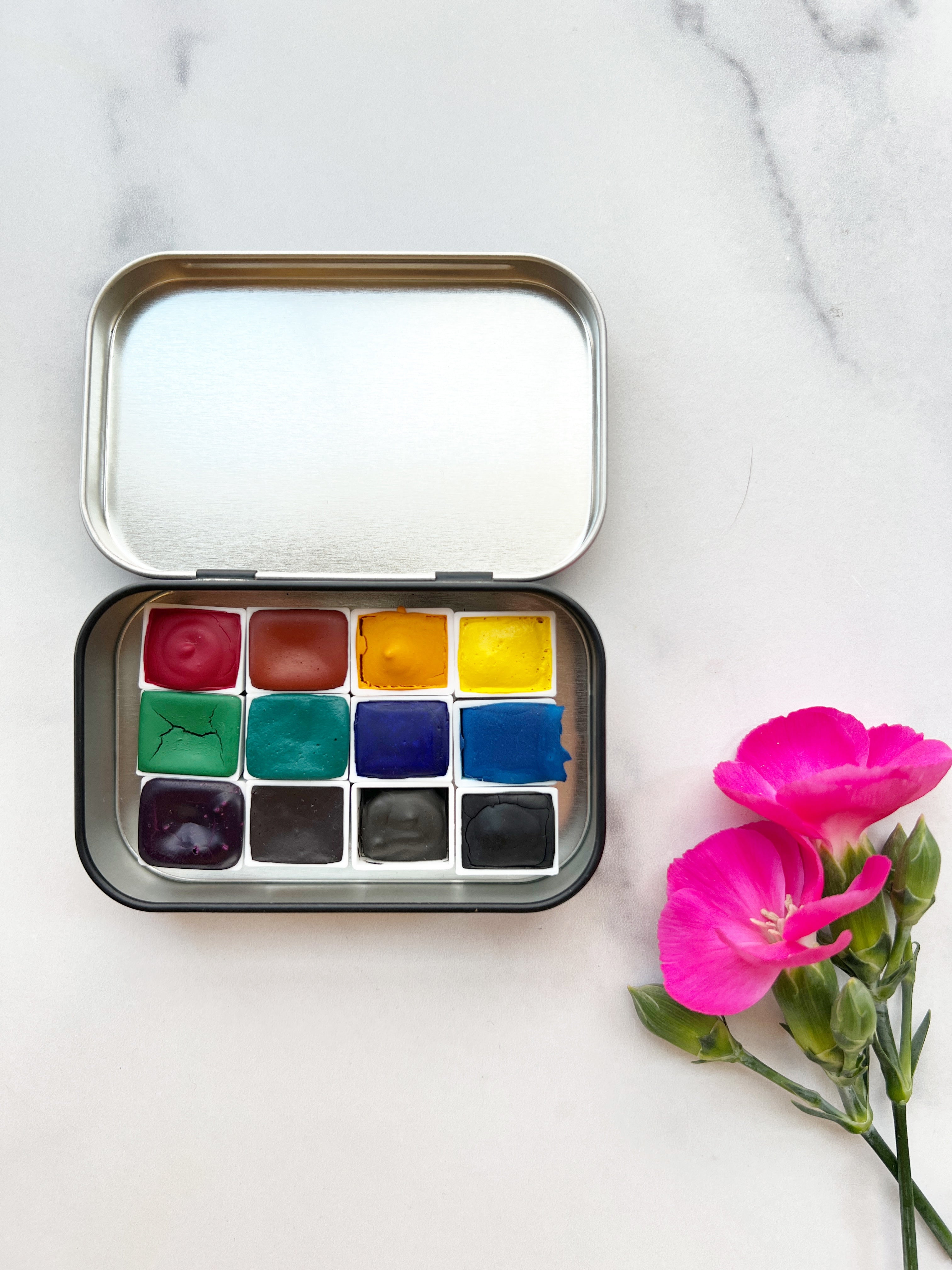 The Wild Rockies Half Pan Set, a palette of handmade watercolor paint