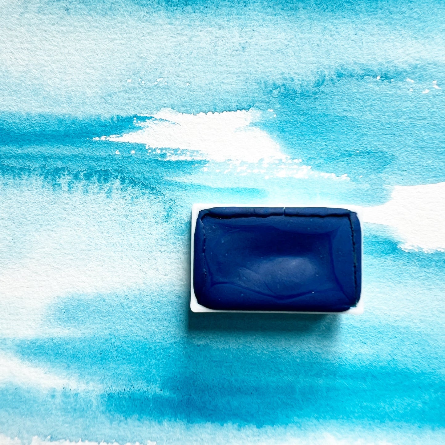 Primary Blue. Half pan or bottle cap of handmade watercolor paint