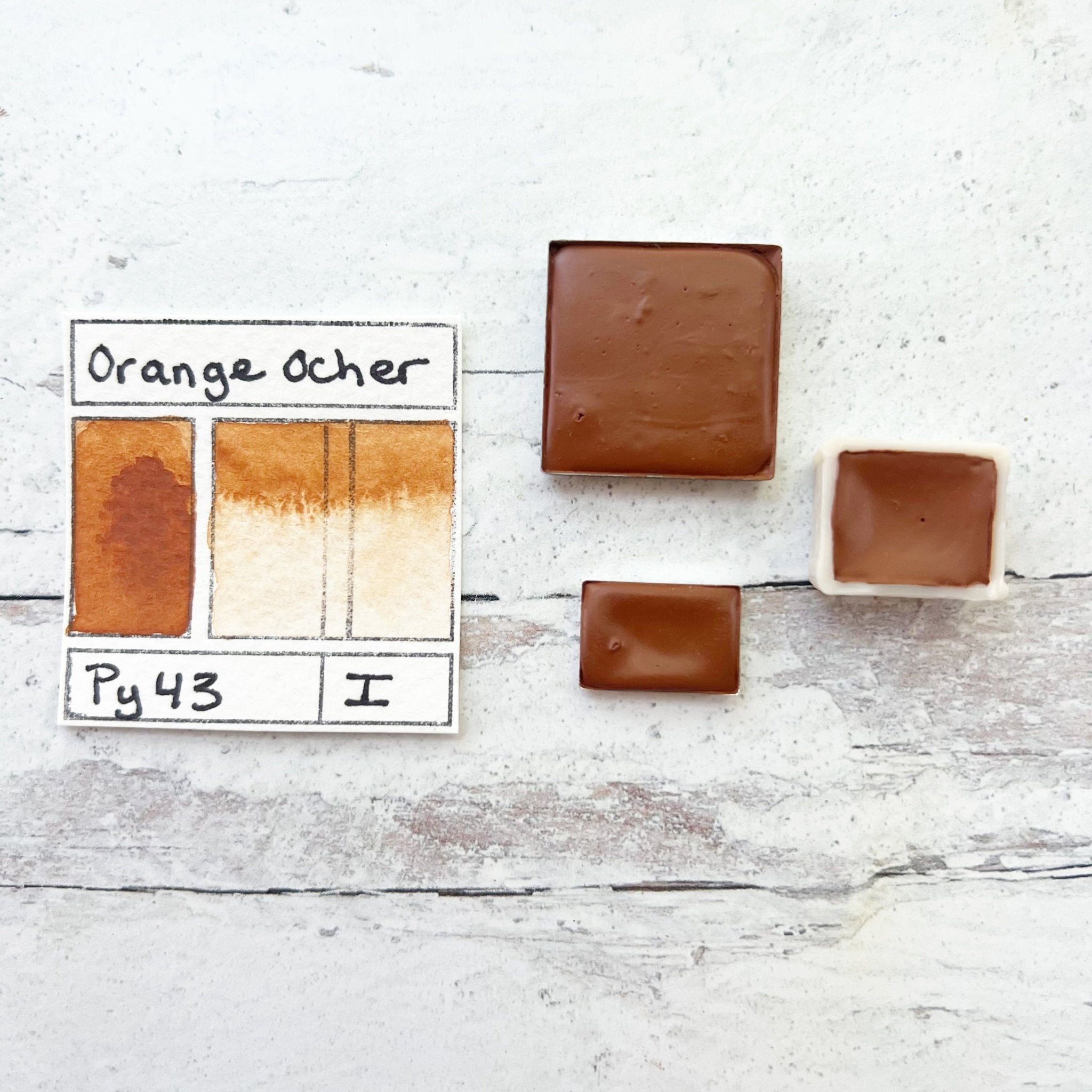 Orange Ocher. Half pan, full pan or bottle cap of handmade watercolor paint