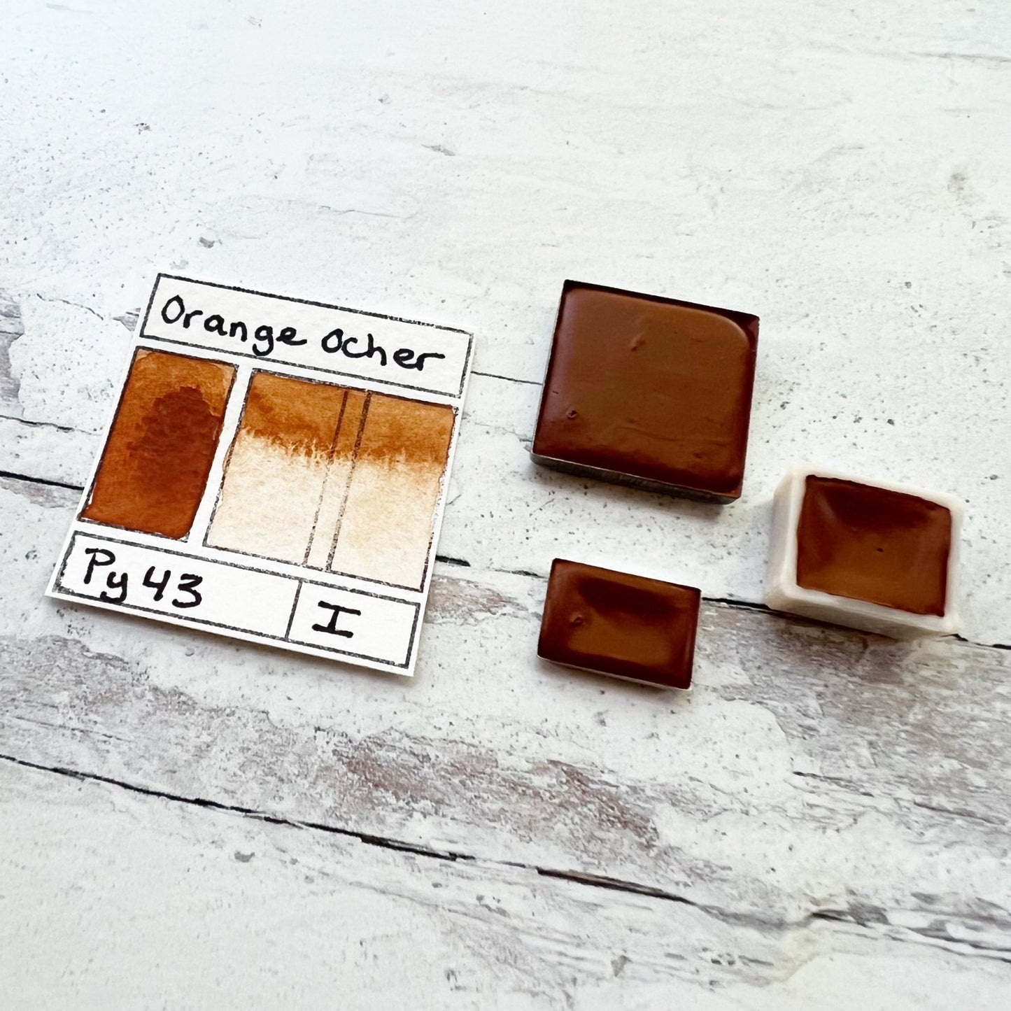 Orange Ocher. Half pan, full pan or bottle cap of handmade watercolor paint