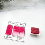 Primary Red. Half pan, full pan or bottle cap of handmade watercolor paint
