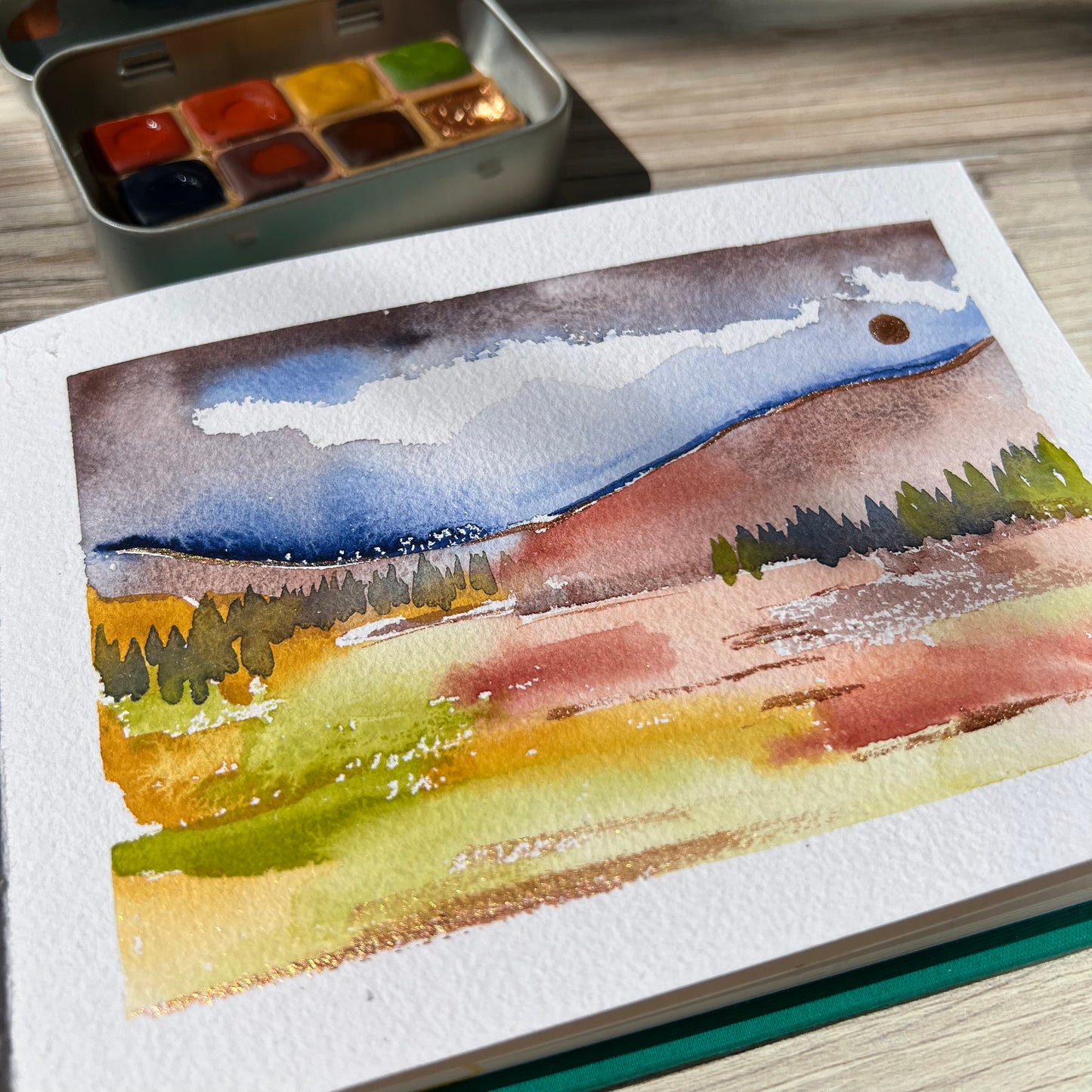 In the Autumn Woods Half Pan Palette, a handmade watercolor painting set
