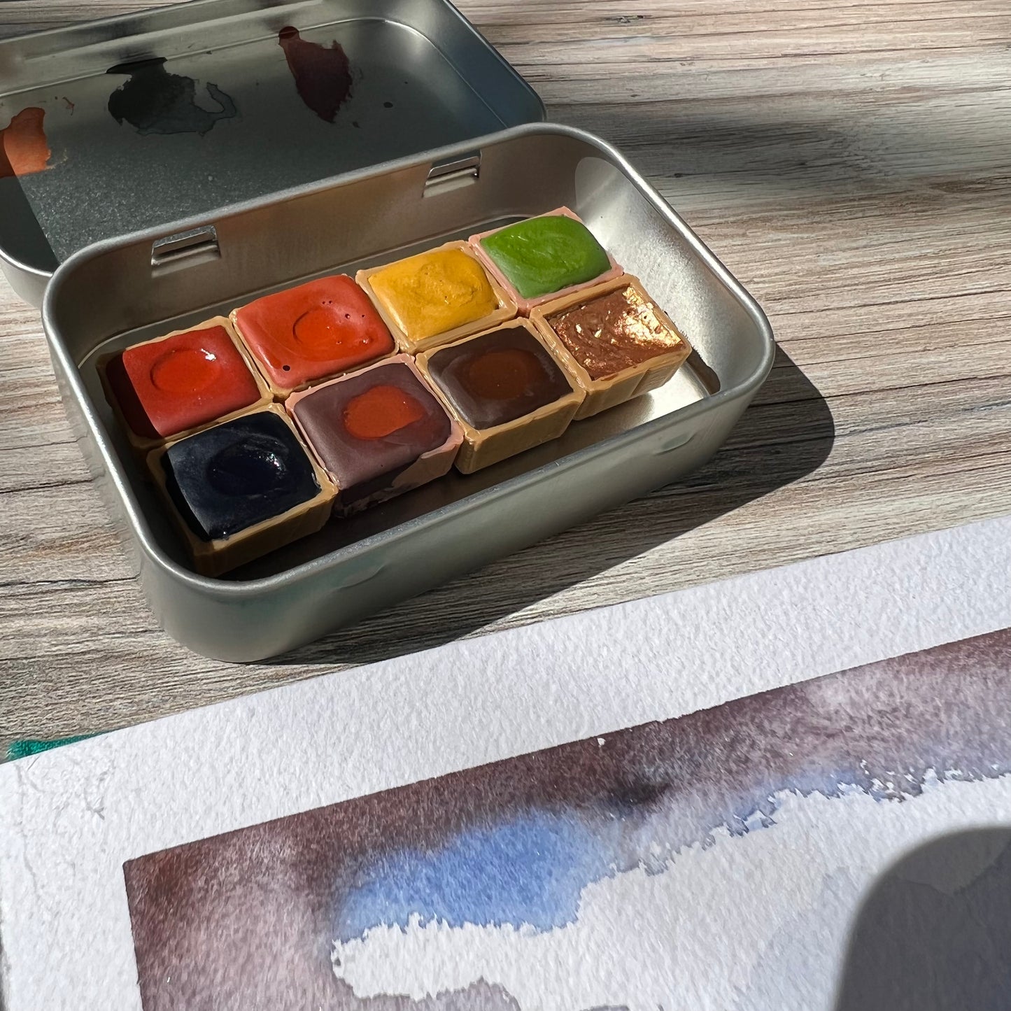 In the Autumn Woods Half Pan Palette, a handmade watercolor painting set