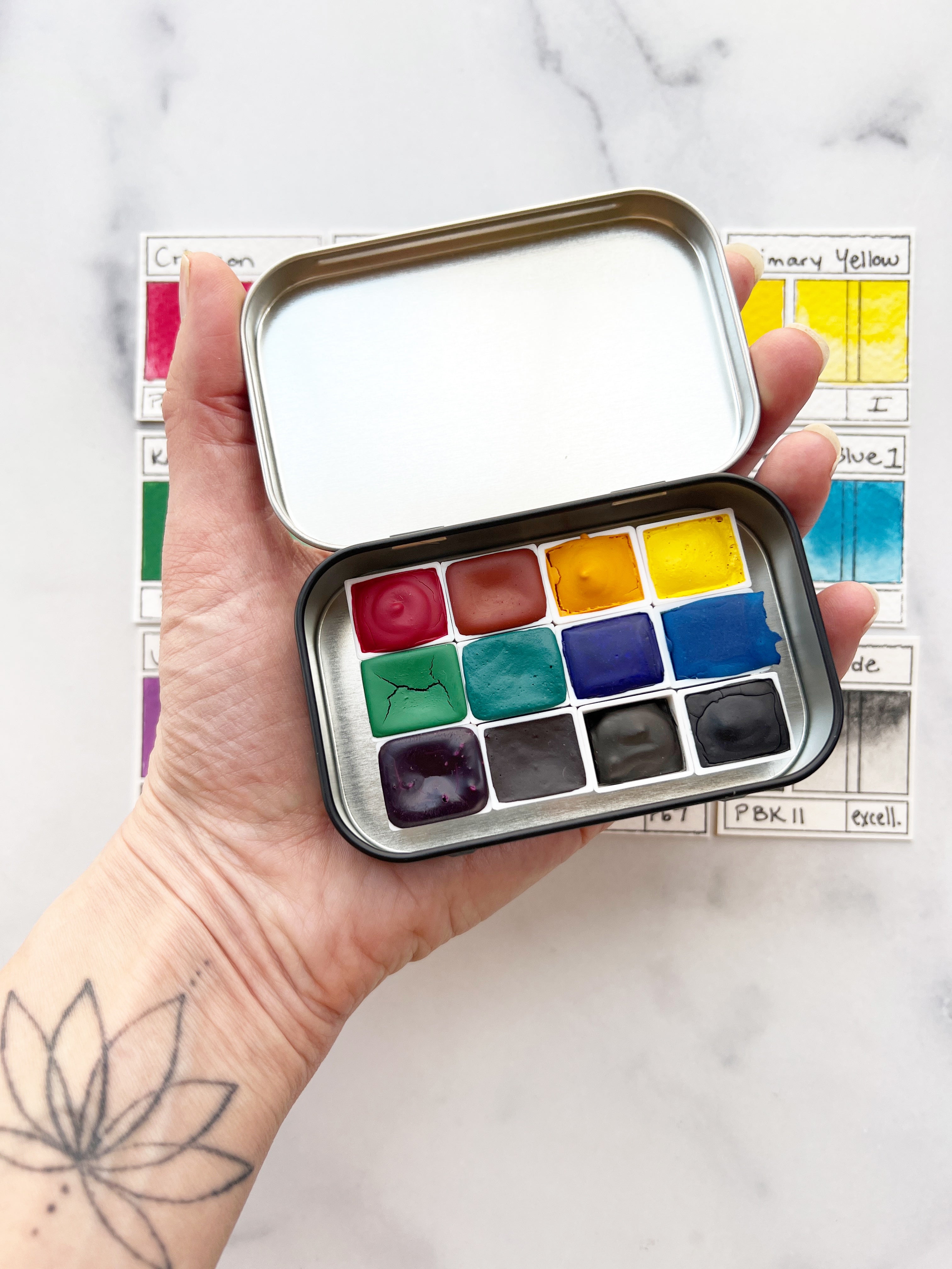 The Wild Rockies Half Pan Set, a palette of handmade watercolor paint