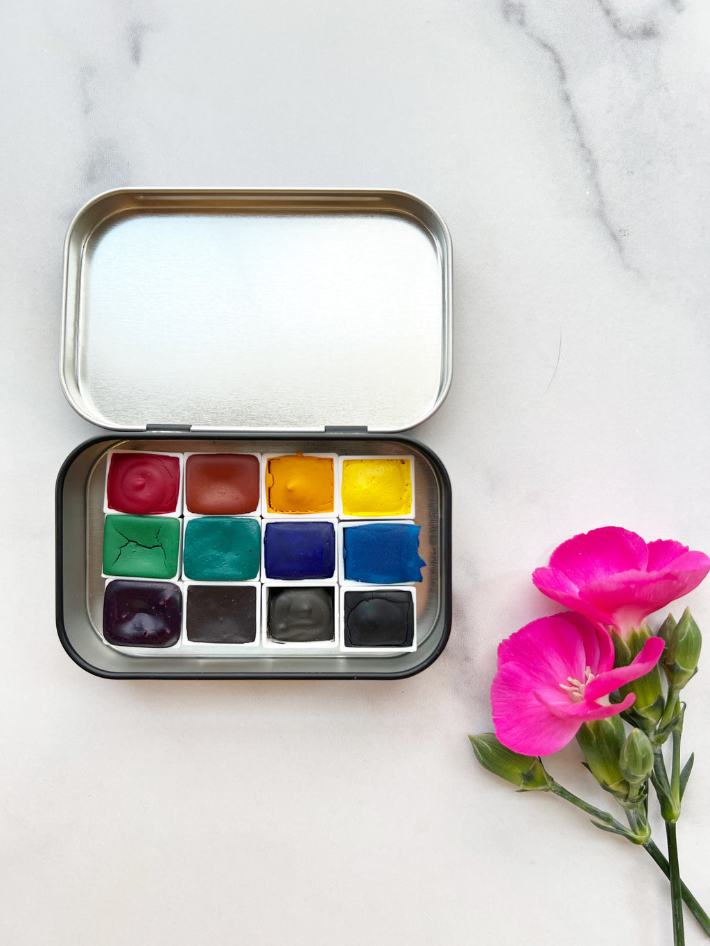 The Wild Rockies Half Pan Set, a palette of handmade watercolor paint