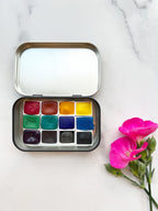 The Wild Rockies Half Pan Set, a palette of handmade watercolor paint