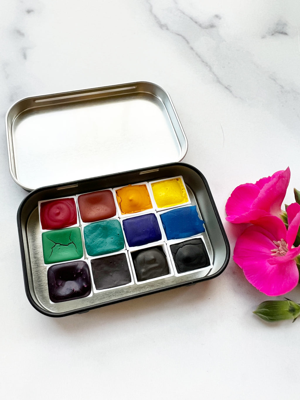 The Wild Rockies Half Pan Set, a palette of handmade watercolor paint