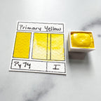Primary Yellow. Half pan or bottle cap of handmade watercolor paint