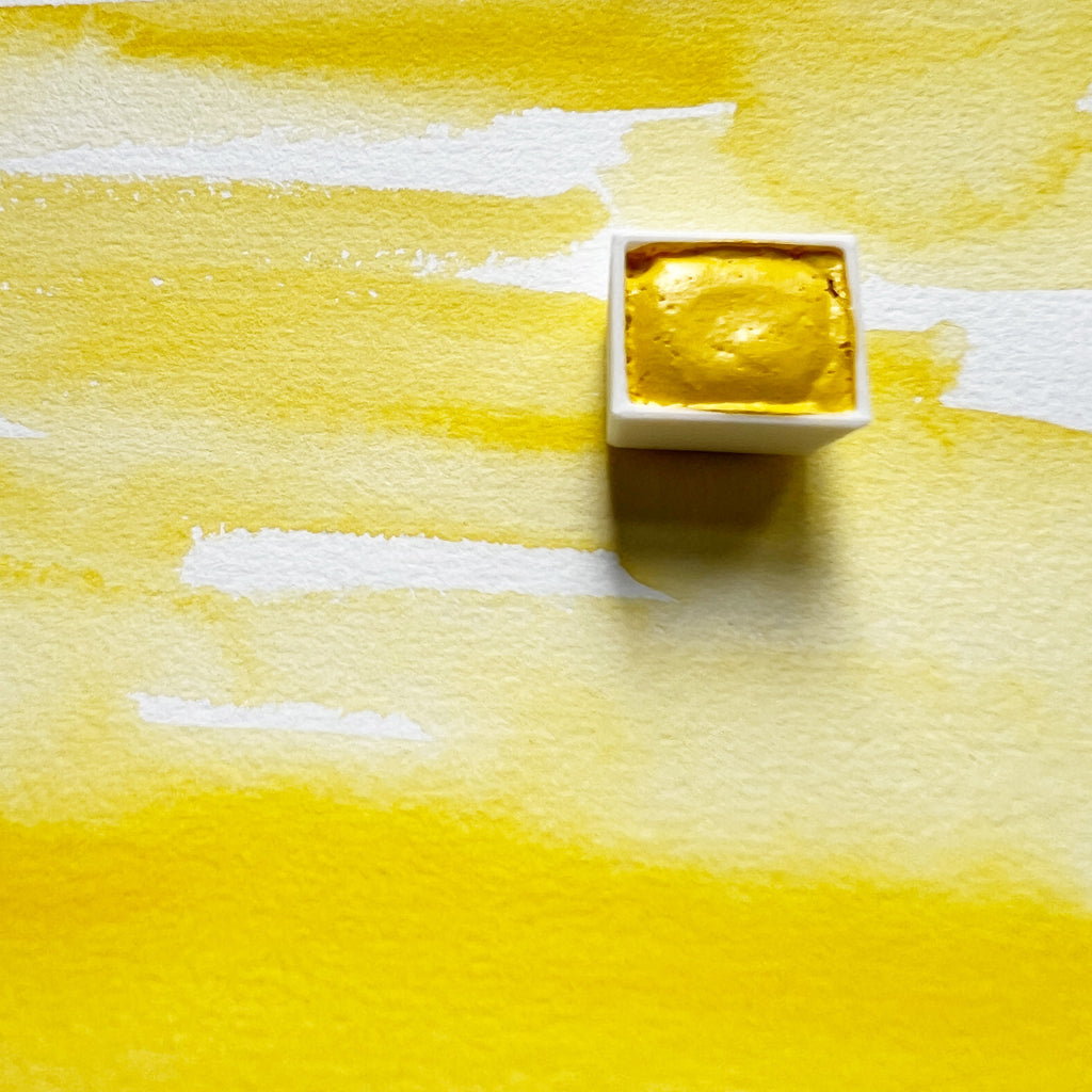 Primary Yellow. Half pan or bottle cap of handmade watercolor paint
