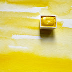 Primary Yellow. Half pan or bottle cap of handmade watercolor paint