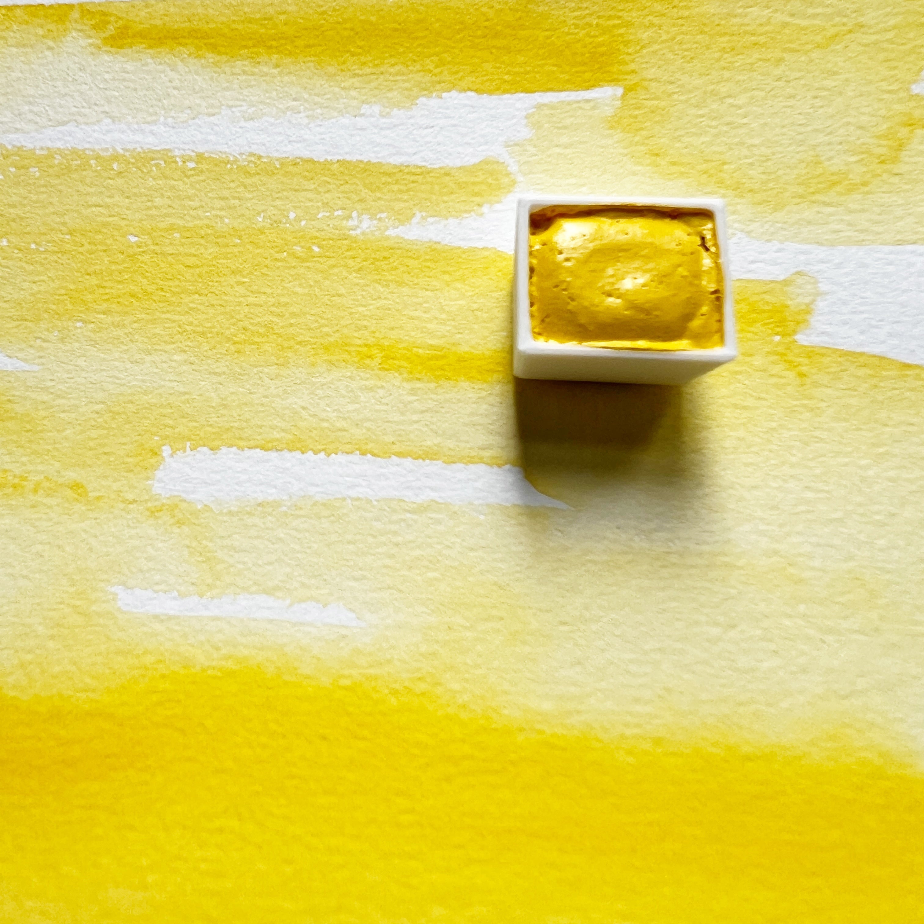 Primary Yellow. Half pan or bottle cap of handmade watercolor paint