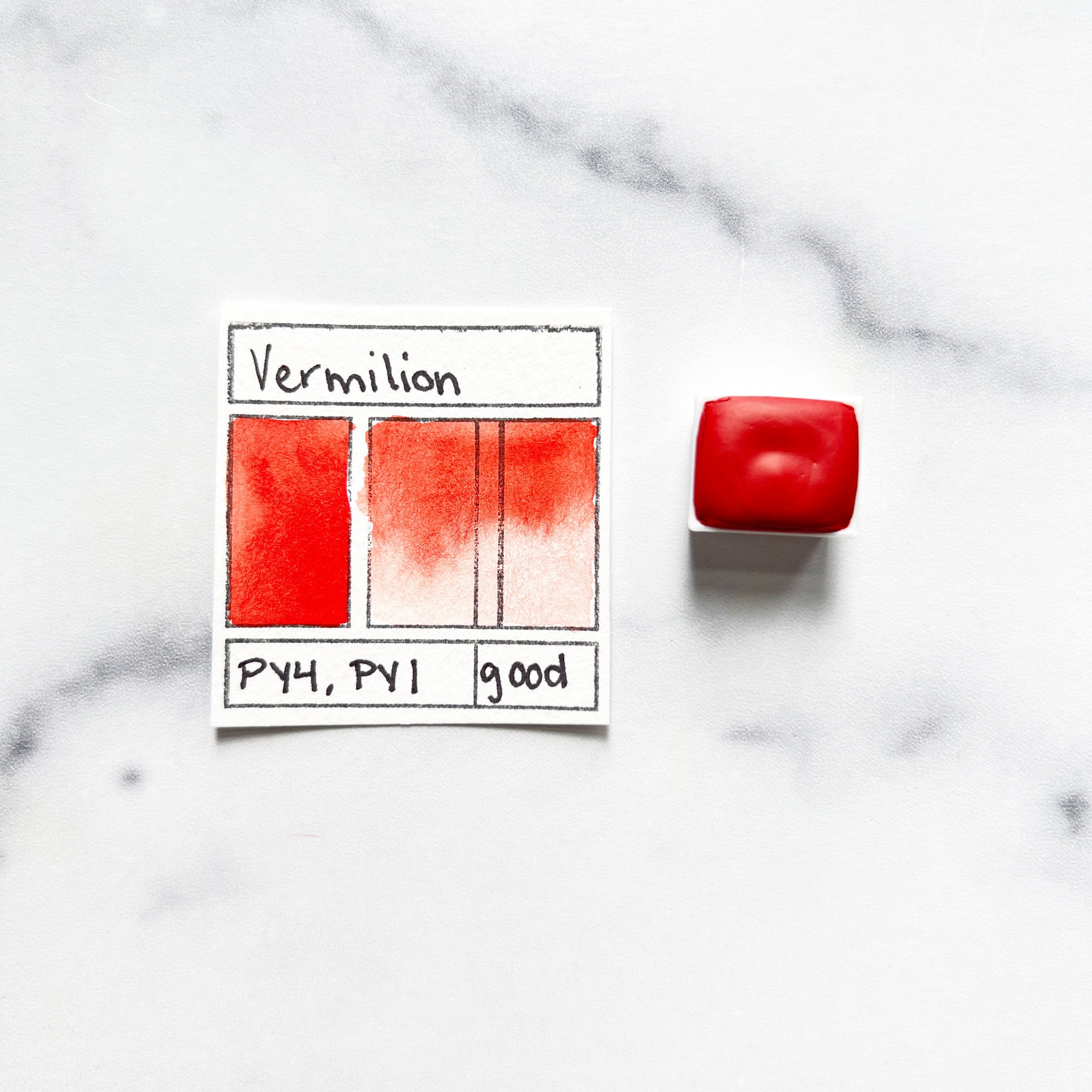 Vermilion. Half pan or bottle cap of handmade watercolor paint