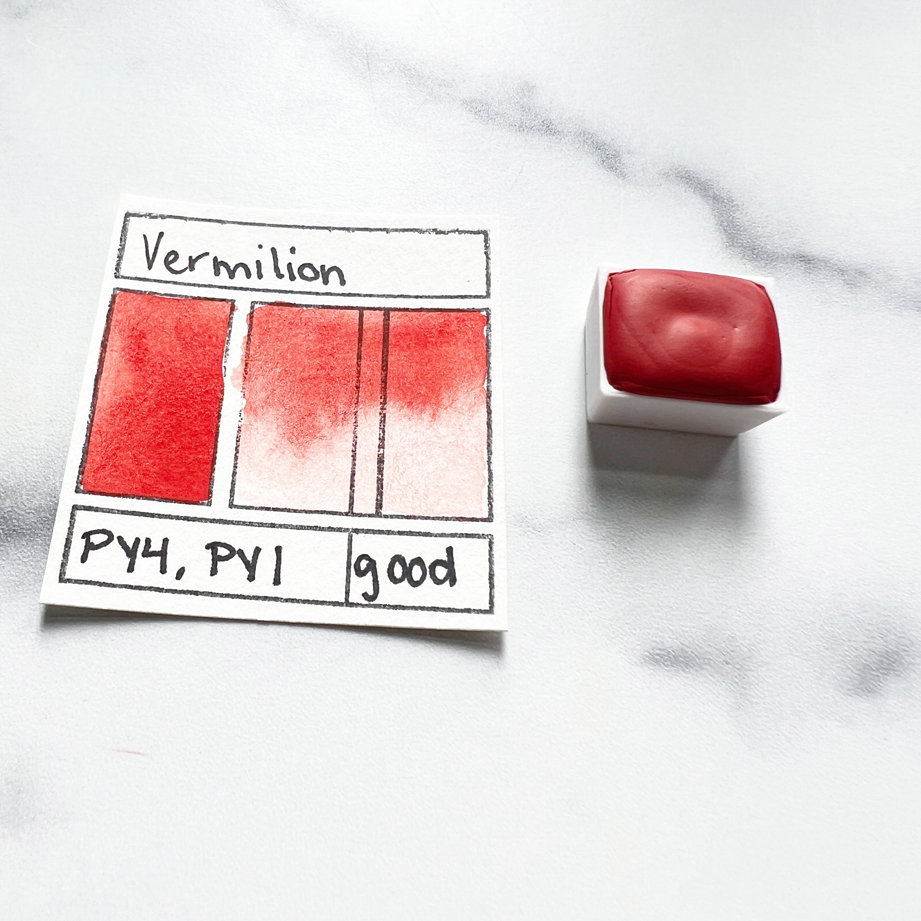 Vermilion. Half pan or bottle cap of handmade watercolor paint