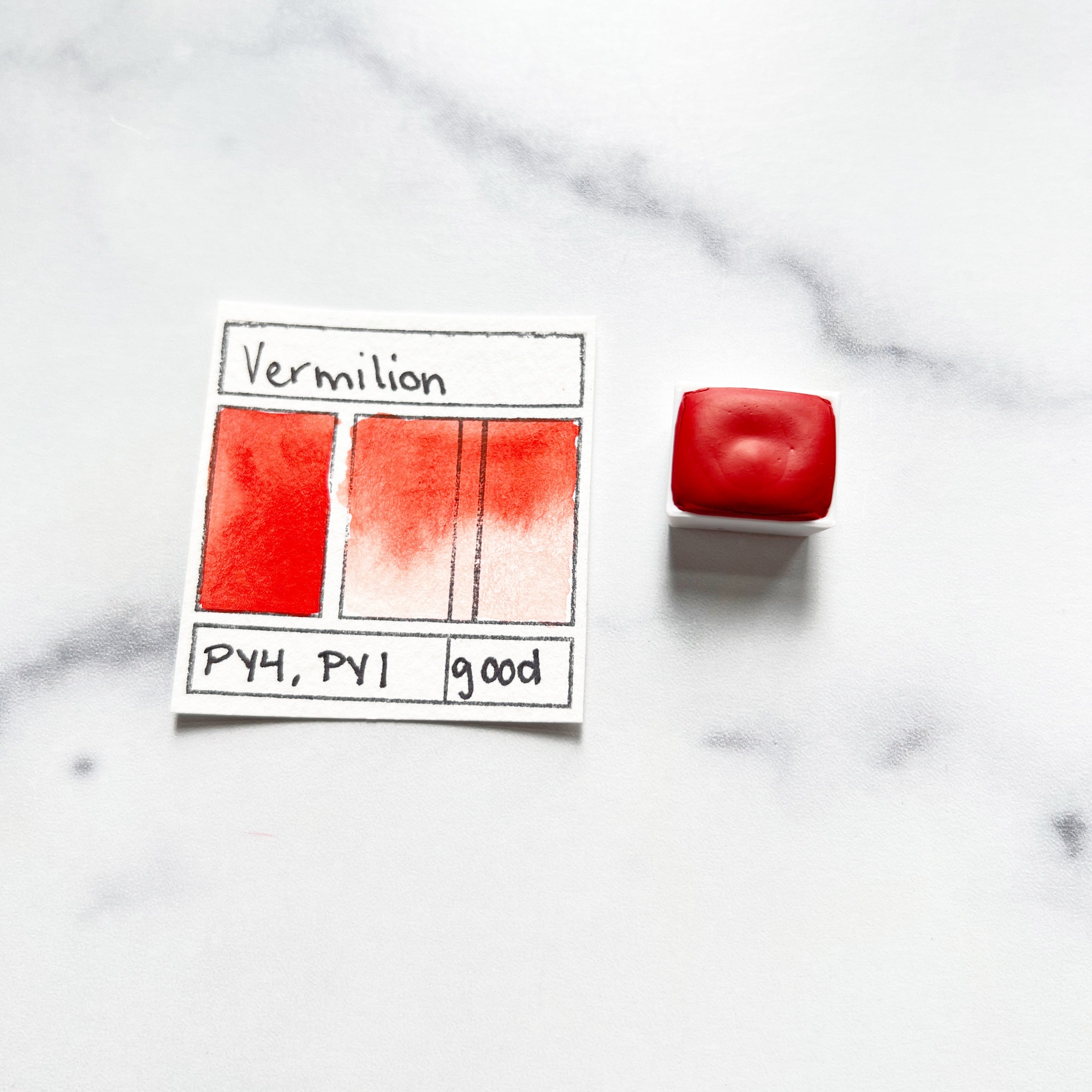 Vermilion. Half pan or bottle cap of handmade watercolor paint