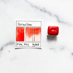 Vermilion. Half pan or bottle cap of handmade watercolor paint