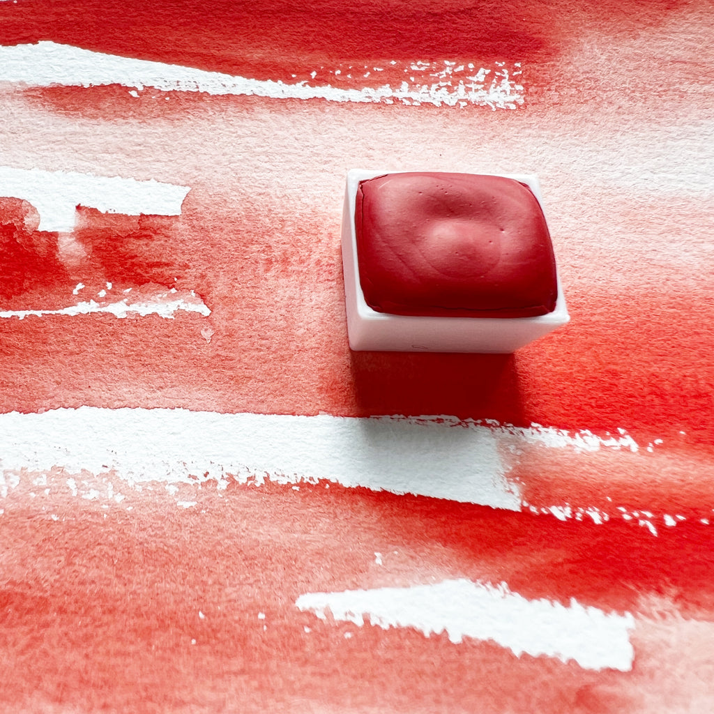 Vermilion. Half pan or bottle cap of handmade watercolor paint