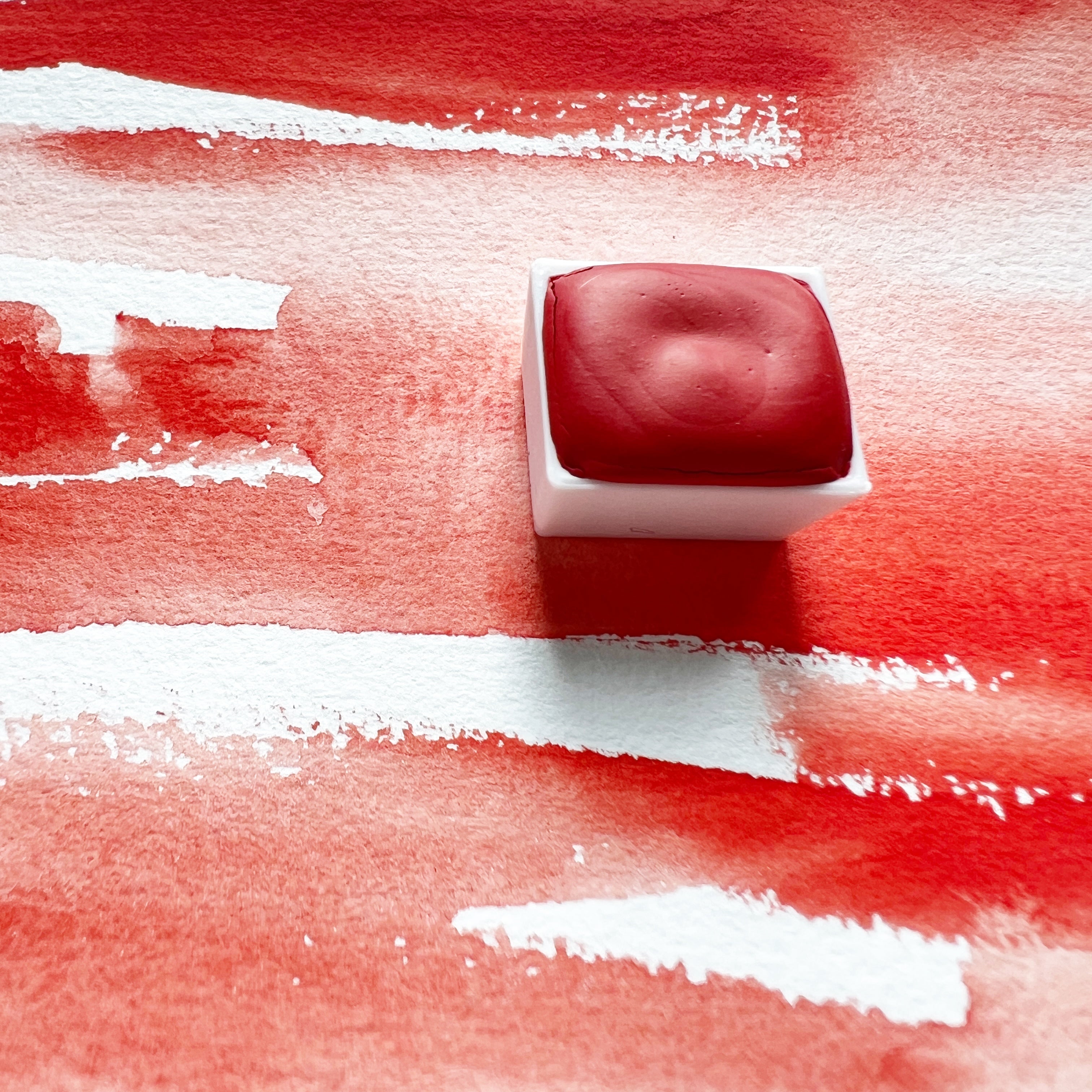 Vermilion. Half pan or bottle cap of handmade watercolor paint