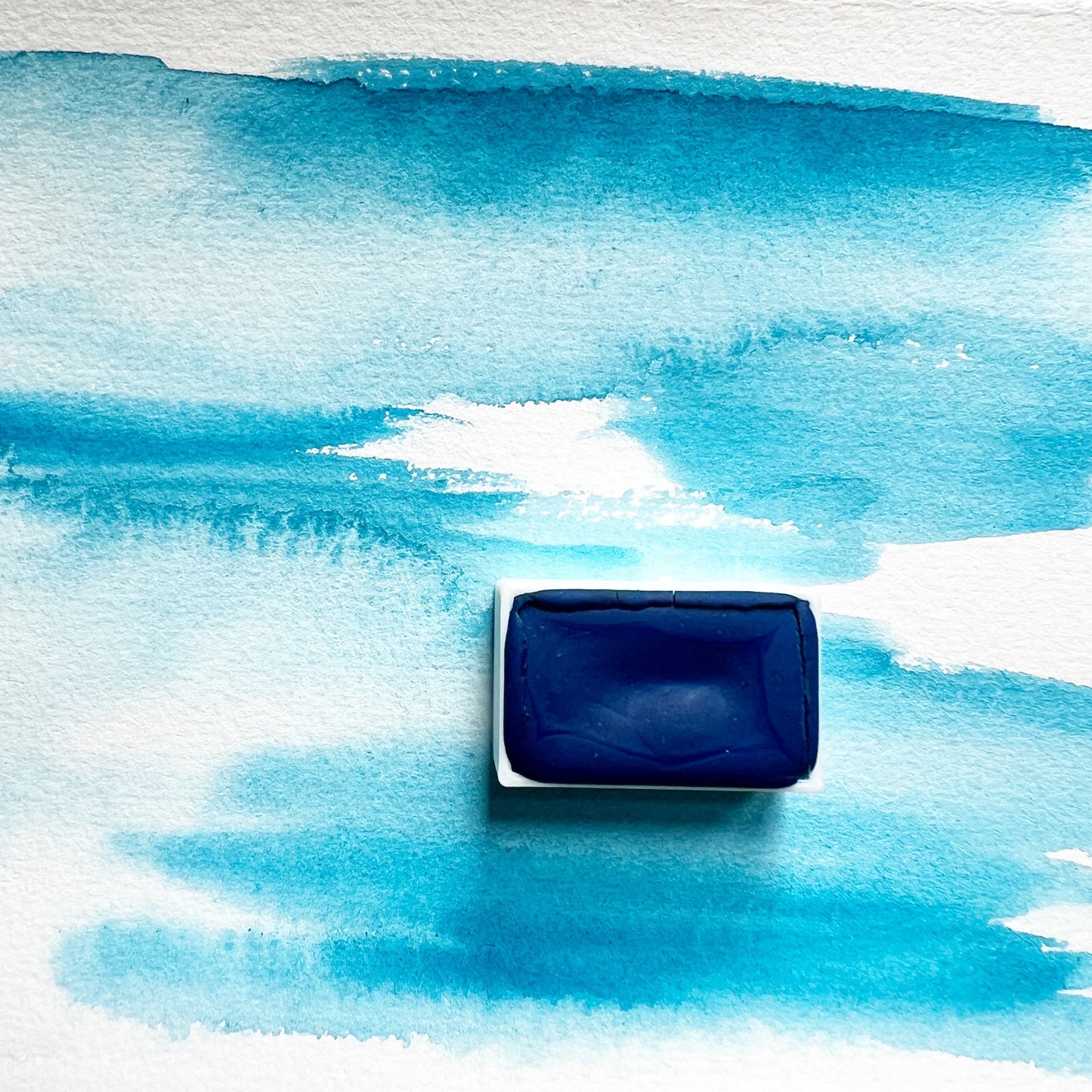 Primary Blue. Half pan or bottle cap of handmade watercolor paint