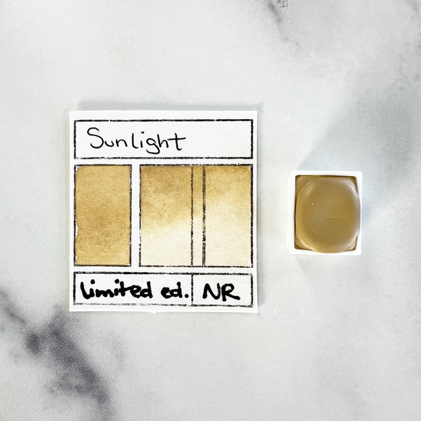 Sunlight. Half pan, full pan or bottle cap of handmade watercolor paint