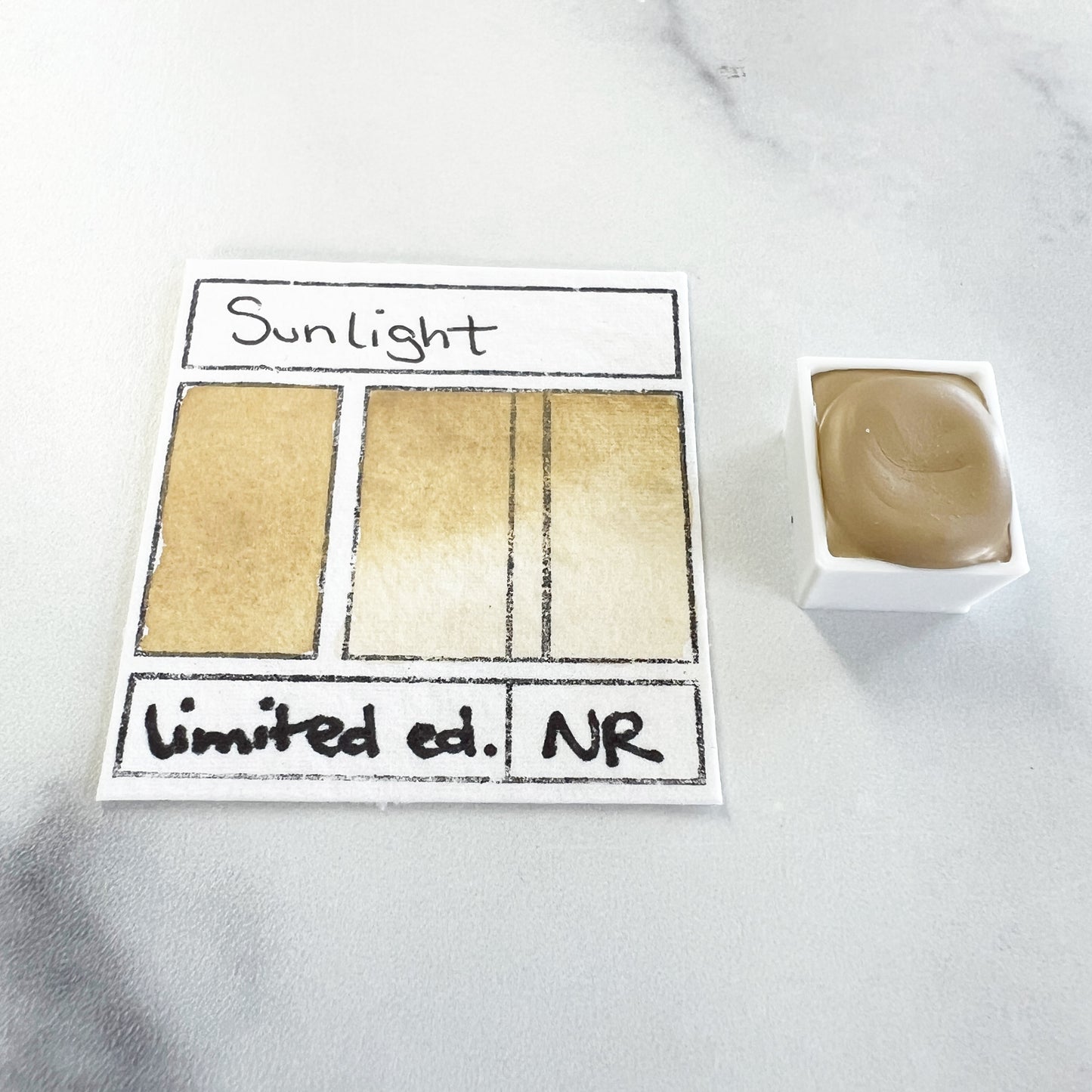 Sunlight. Half pan, full pan or bottle cap of handmade watercolor paint