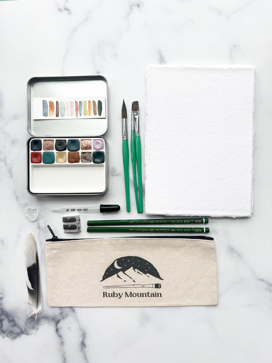 The Hilda Set, a handmade watercolor set in a collaged tin