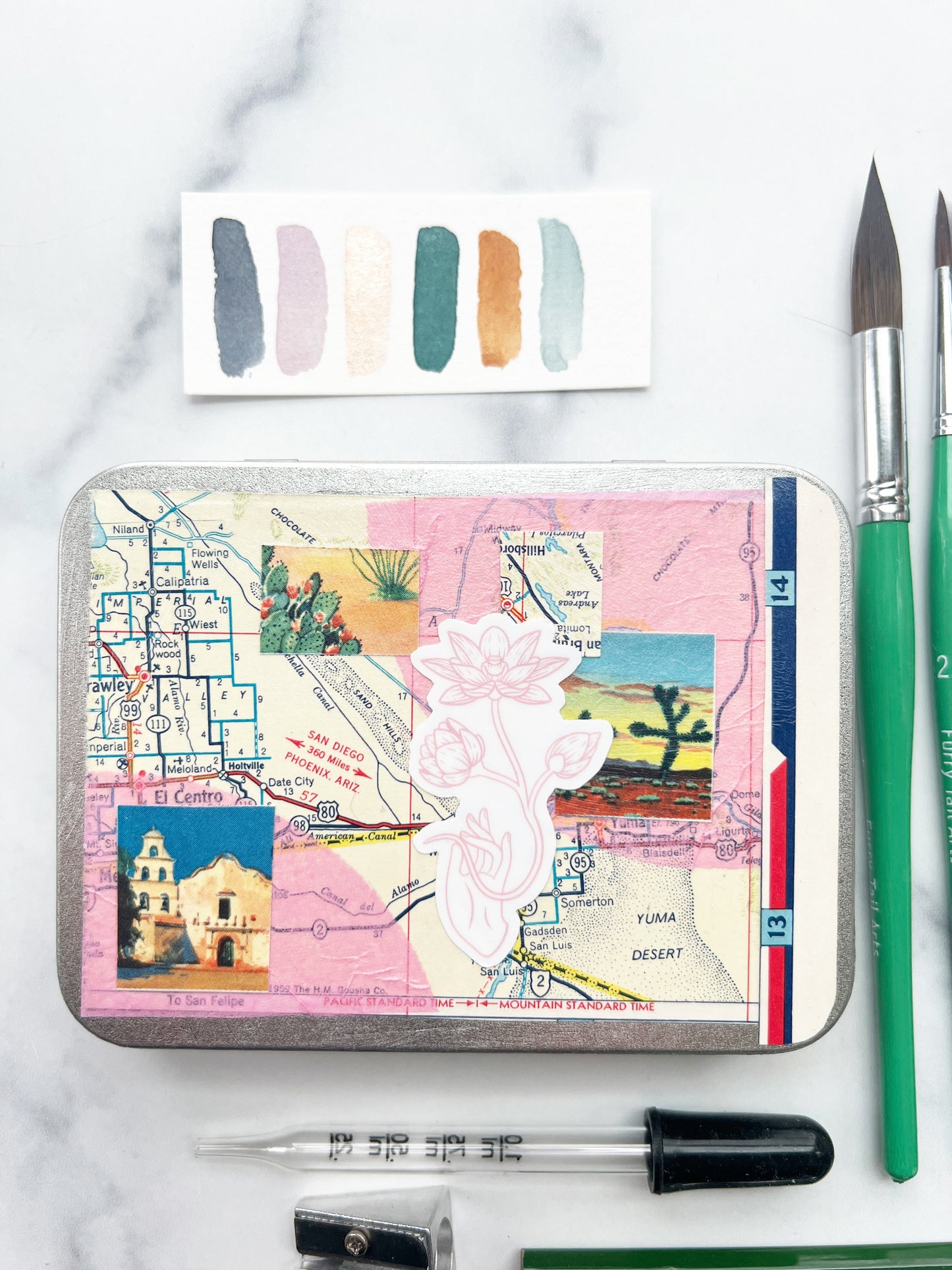 The Yuma Set, a handmade watercolor set in a collaged tin