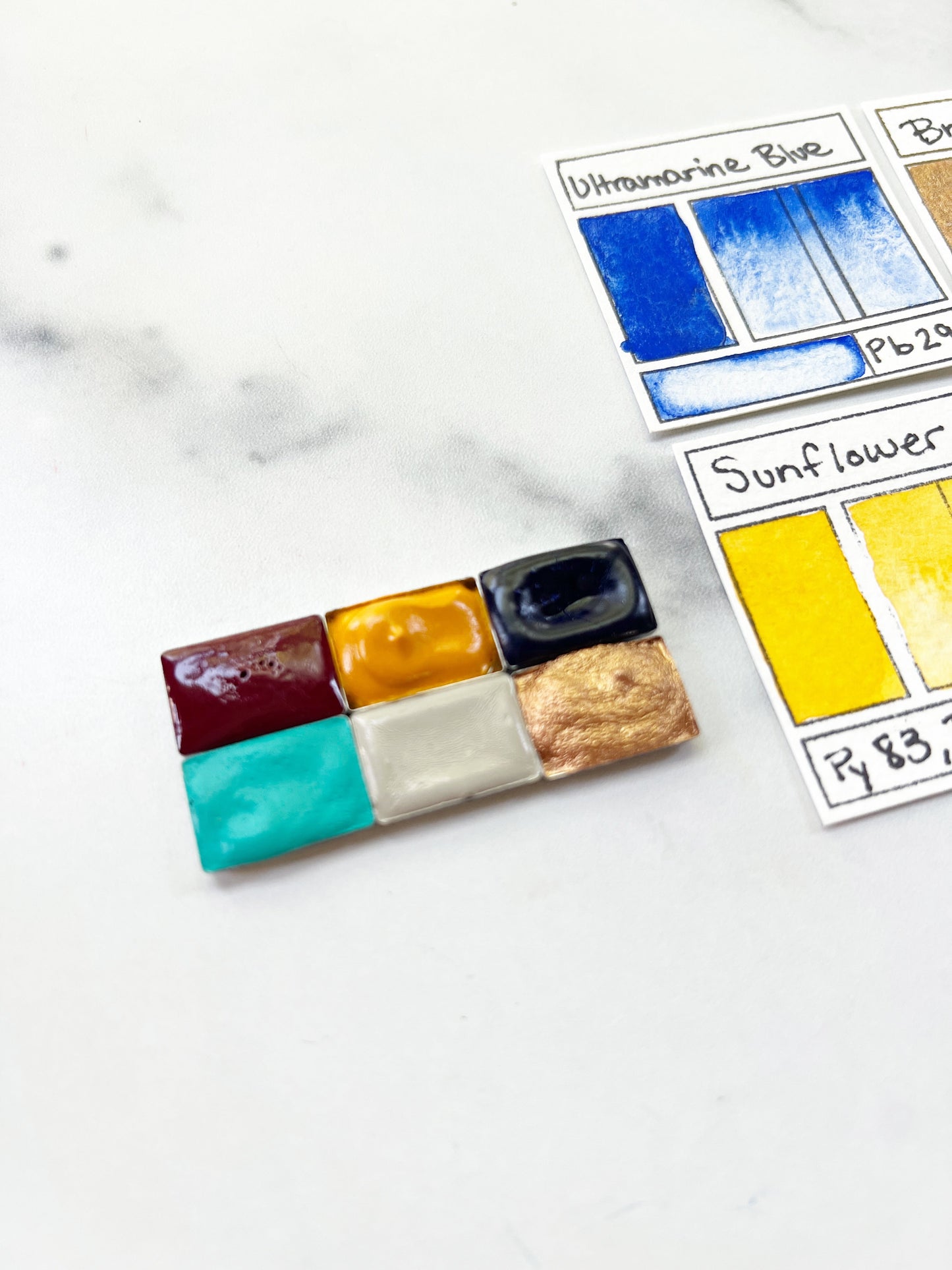 Color swatch palette with labeled colors on a marble surface