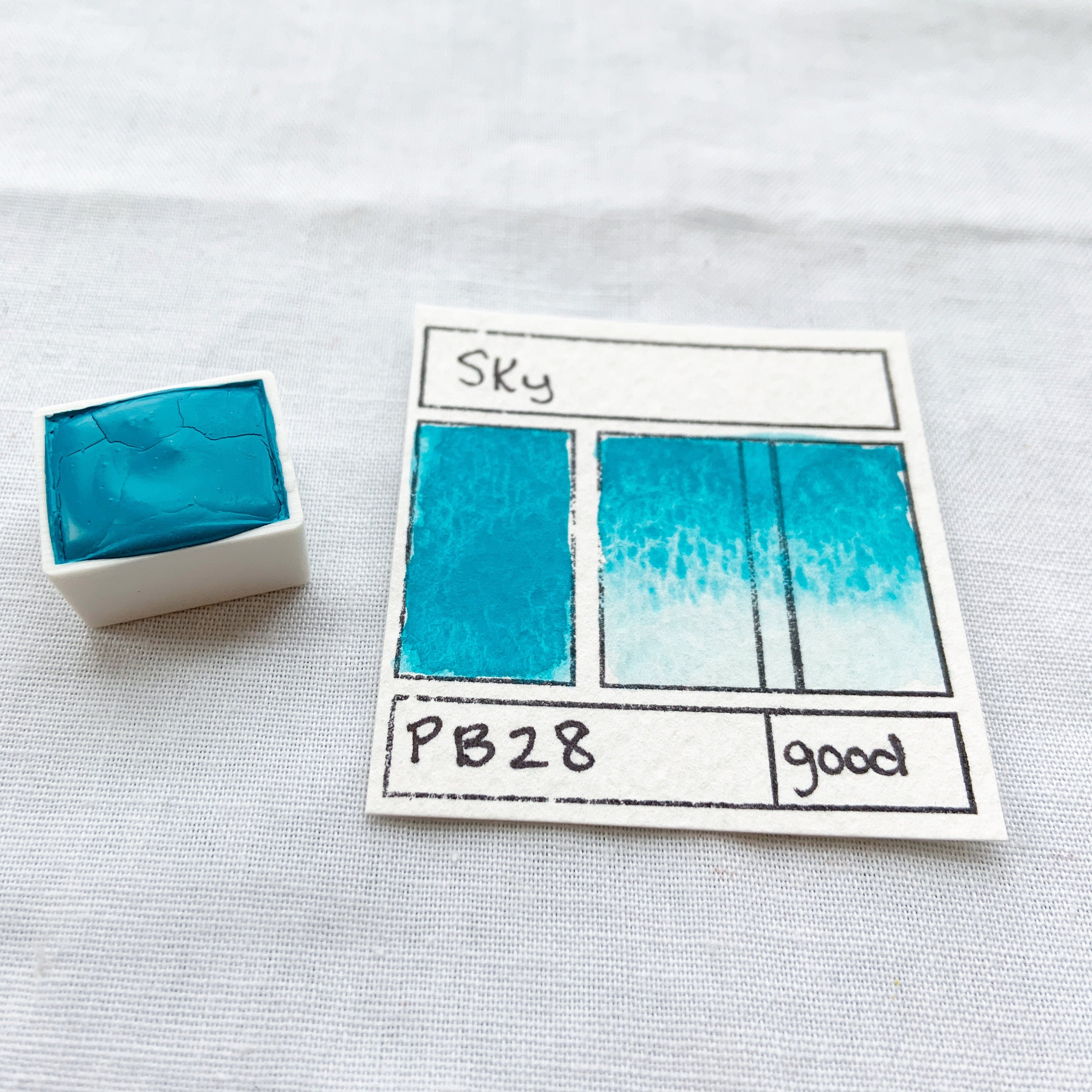 Sky. Half pan, full pan or bottle cap of handmade watercolor paint
