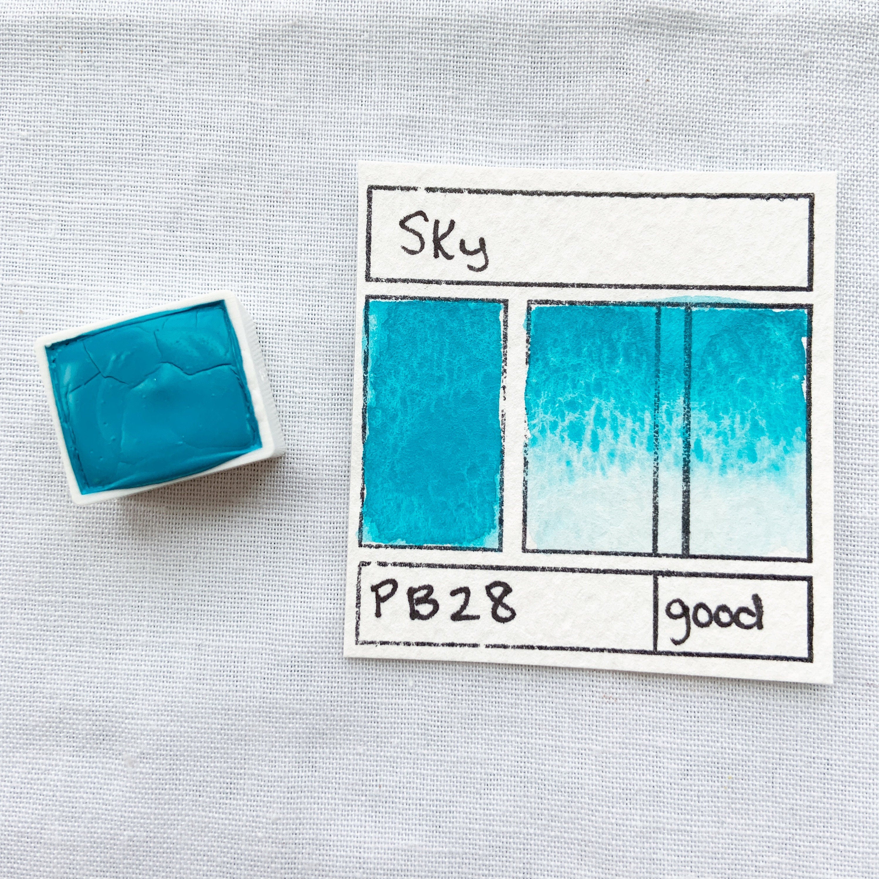Sky. Half pan, full pan or bottle cap of handmade watercolor paint